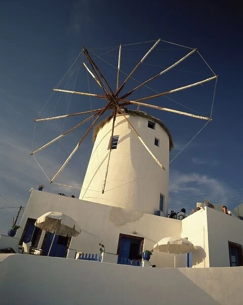 Traditional thatched windmill in the village of Oia