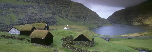 Traditional turf roofed farm buildings and church, Saksun, Streymoy Island
