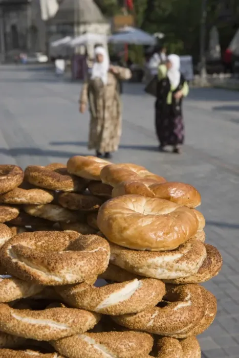 Framed Print : Traditional Turkish bagels with sesame seeds for sale, ladies in traditional costume in distance Framed Print : Traditional Turkish bagels with sesame seeds for sale, ladies in traditional costume in distance