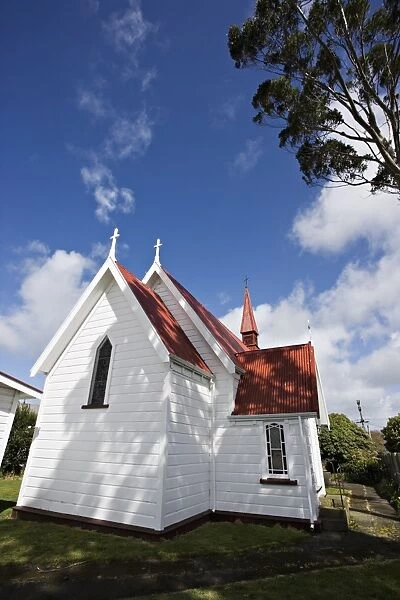 Traditional weatherboard church with corrugated iron roof