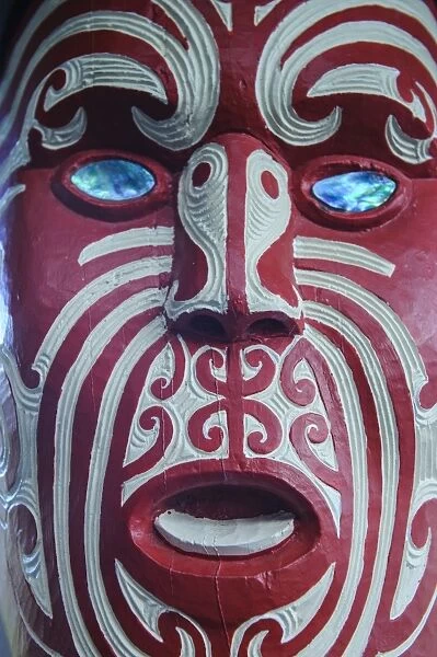 Traditional wood carved mask in the Te Puia Maori Cultural Center, Rotorura, North Island, New Zealand, Pacific