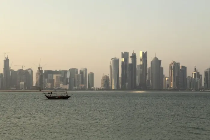 Framed Print : A traditional wooden dhow boat sails past modern skyscrapers in the West Bay financial district of Doha, Qatar, Middle East Framed Print : A traditional wooden dhow boat sails past modern skyscrapers in the West Bay financial district of Doha, Qatar, Middle East