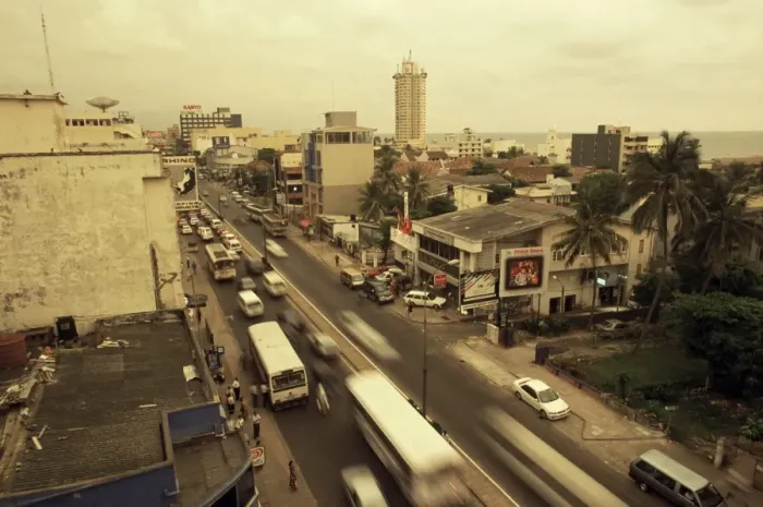 Framed Print : Traffic in Colombo beneath monsoon skies