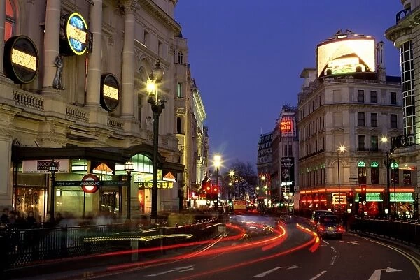 Traffic trails and theatre signs at night near Piccadilly Circus, London