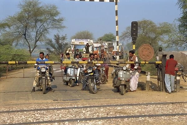 Traffic waiting at railway crossing