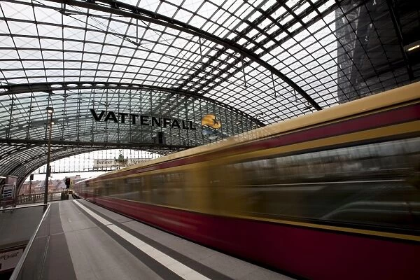 Train leaving Berlin Hauptbahnhof, the main railway station in Berlin, Germany, Europe