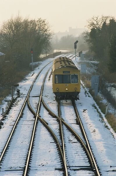 Train on snowy tracks, Norfolk, England, United Kingdom, Europe