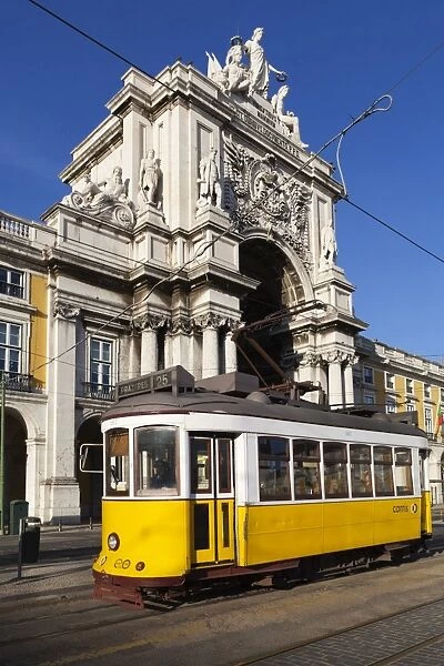 Tram (electricos) below the Arco da Rua Augusta in Praca do Comercio, Baixa, Lisbon, Portugal, Europe