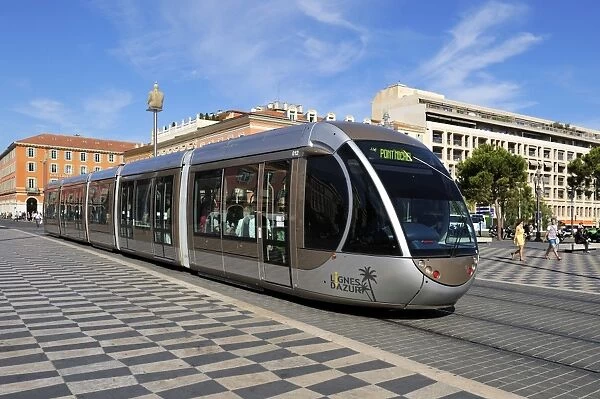 Tram passing through Place Massena, Nice, Alpes Maritimes, Provence, Cote d Azur