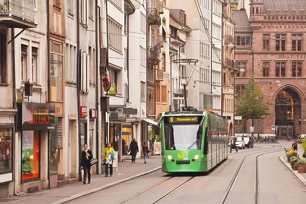 A tram runs down the streets of Basel in Switzerland, Europe