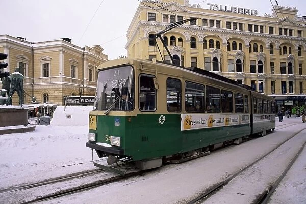 Tram in street in winter, Helsinki, Finland, Scandinavia, Europe