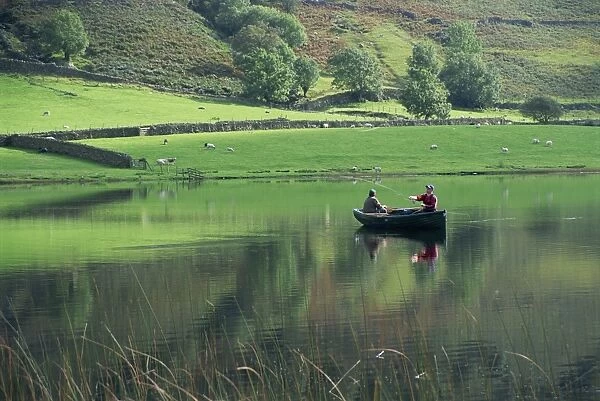 Tranquil scene of two men in a boat on a lake, fly fishing, Watendlath Tarn
