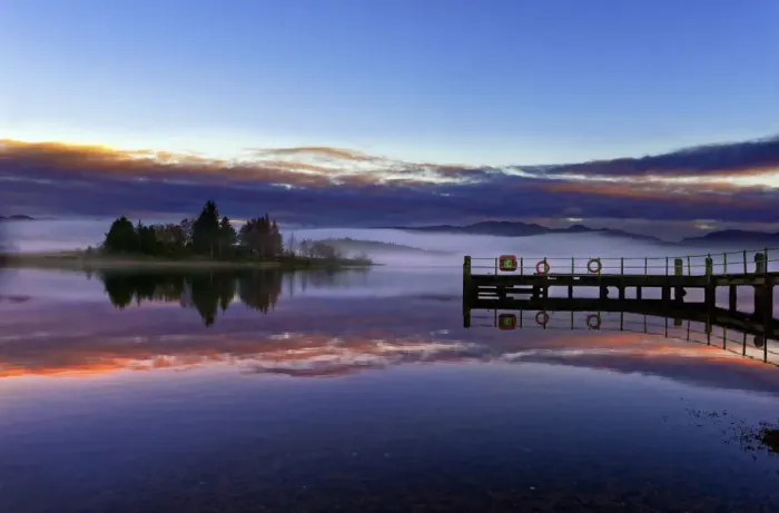 Framed Print : A tranquil view across the calm waters of Loch Shiel as dawn breaks on a misty winter morning Framed Print : A tranquil view across the calm waters of Loch Shiel as dawn breaks on a misty winter morning