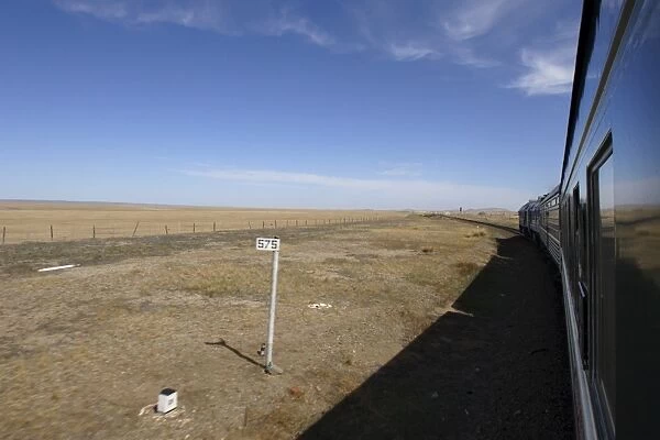 Trans-Mongolian train travelling through the Gobi desert