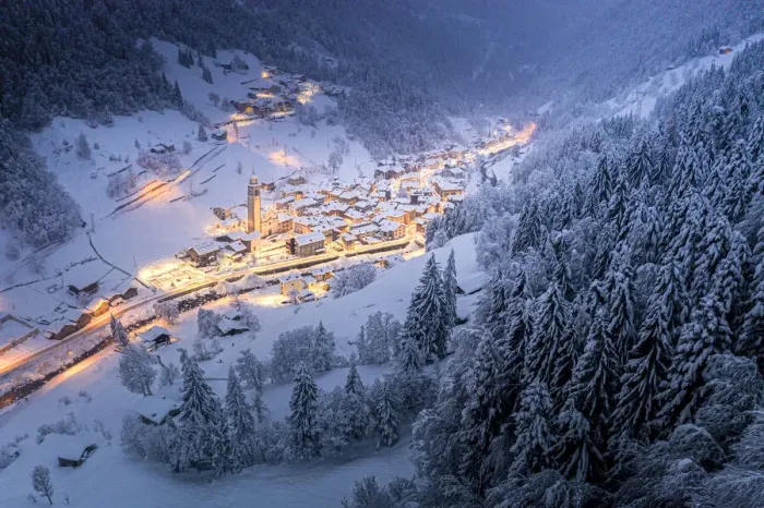 Framed Print : Trees covered with snow in the winter forest surrounding the alpine village at Christmas Framed Print : Trees covered with snow in the winter forest surrounding the alpine village at Christmas