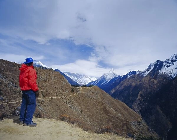 Trekker looking at Ama Dablan and other mountains of the Himalayas