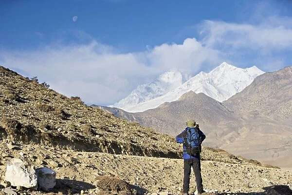 Trekker taking a photo on the Annapurna circuit trek