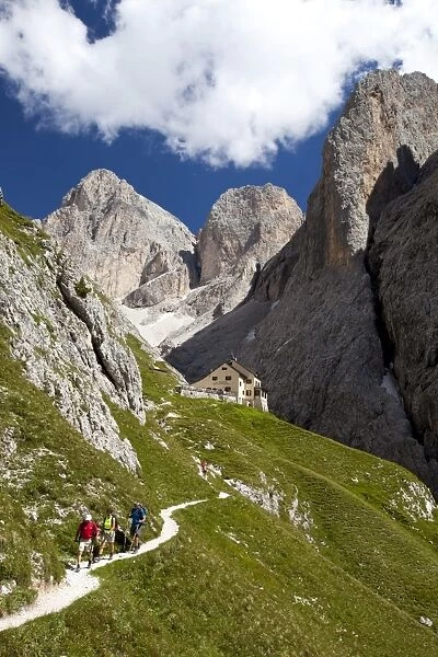 Trekkers and Bergamo alpine refuge, Rosengarten mountain range, Dolomites