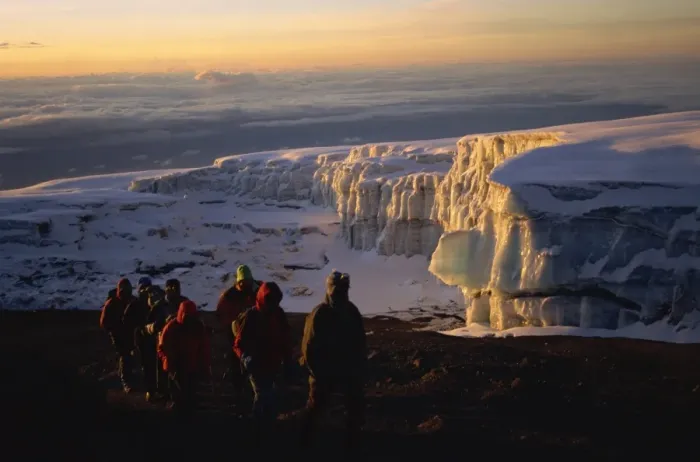 Framed Print : Trekkers and glacier at sunrise on summit of Kibo, 5895m, Kilimanjaro National Park Framed Print : Trekkers and glacier at sunrise on summit of Kibo, 5895m, Kilimanjaro National Park