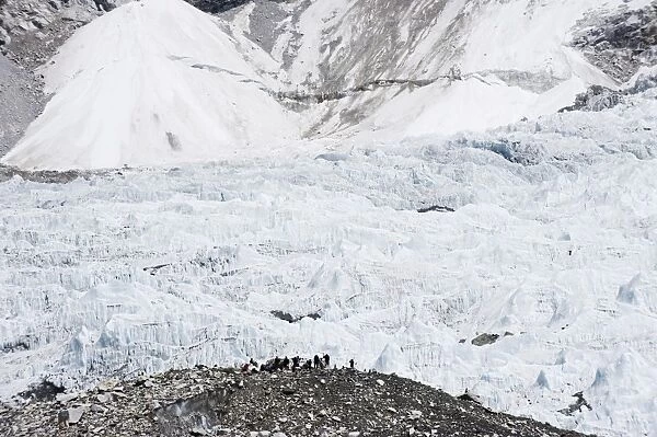 Trekkers below the The Western Cwm glacier at Everest Base Camp, Solu Khumbu Everest Region
