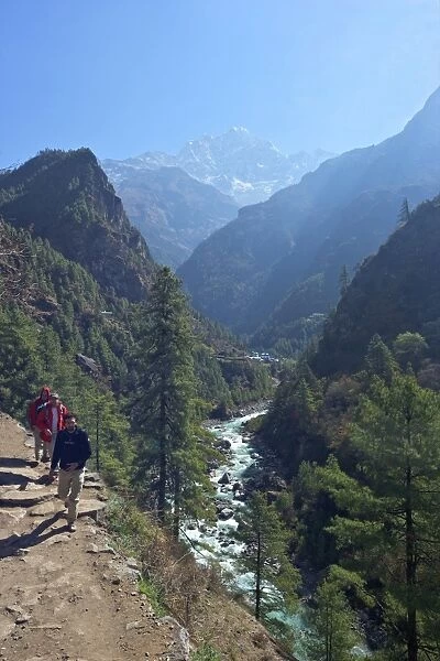 Trekkers on trail beside Dudh Koshi river, between Phakding and Namche, Chumoa, Everest Base Camp Trek, Solukhumbu, Nepal, Himalayas, Asia