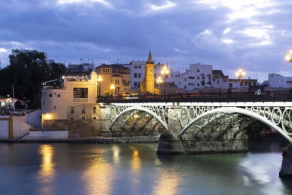 The Triana Bridge (Puente de Triana) (Puente de Isabelle II) at twilight, Seville
