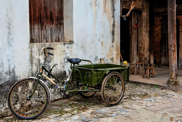 Framed Print : Tricycle outside an old house in Changle Village, dating back to the Song Dynasty, Lanxi County, Jinhua City, Zhejiang Province, China Framed Print : Tricycle outside an old house in Changle Village, dating back to the Song Dynasty, Lanxi County, Jinhua City, Zhejiang Province, China
