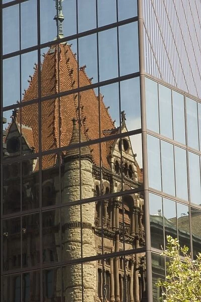 Trinity Church reflected in the glass windows of the Hancock Tower
