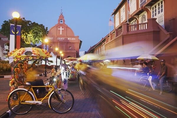 Trishaws passing in Town Square, Melaka, Malaysia, Southeast Asia, Asia