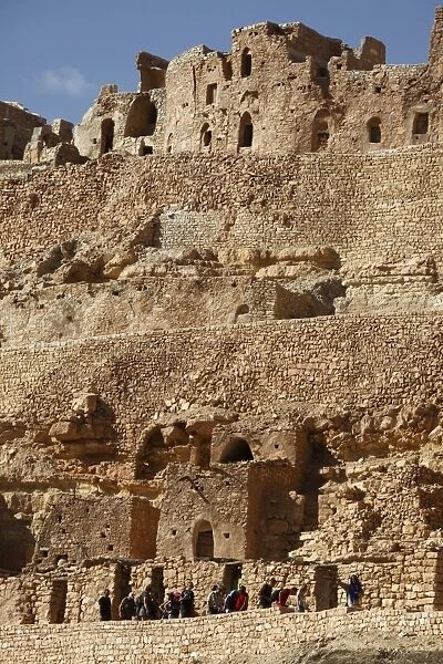 Troglodyte cave dwellings and granary niches known as ghorfas, hillside Berber village of Chenini