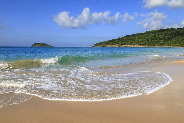 Tropical Anse de la Perle beach, golden sand, turquoise blue sea