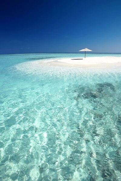 Tropical sandbank and sun umbrella, Maldives, Indian Ocean, Asia