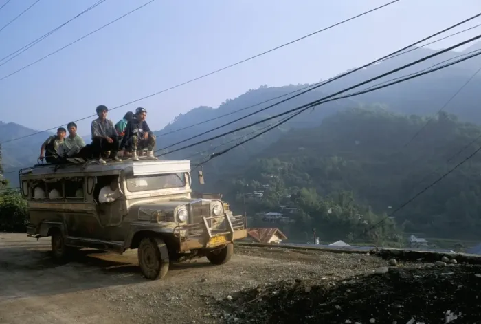 Framed Print : Truck carrying passengers on the roof