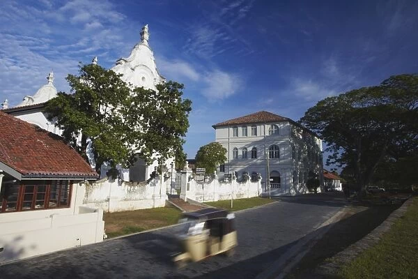 Tuk tuk passing Dutch Reformed Church, Galle, Southern Province, Sri Lanka, Asia