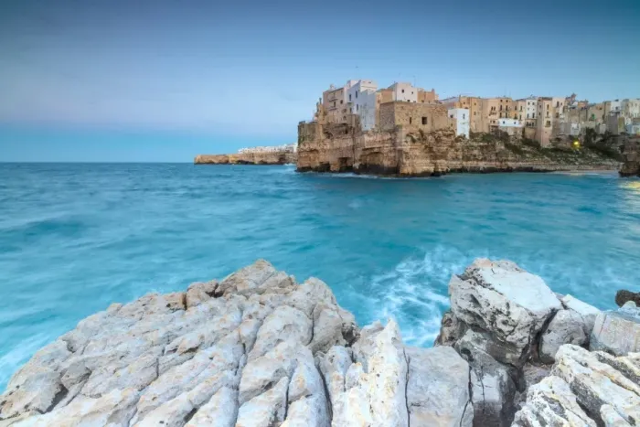 Framed Print : Turquoise sea at dusk framed by the old town perched on the rocks, Polignano a Mare Framed Print : Turquoise sea at dusk framed by the old town perched on the rocks, Polignano a Mare