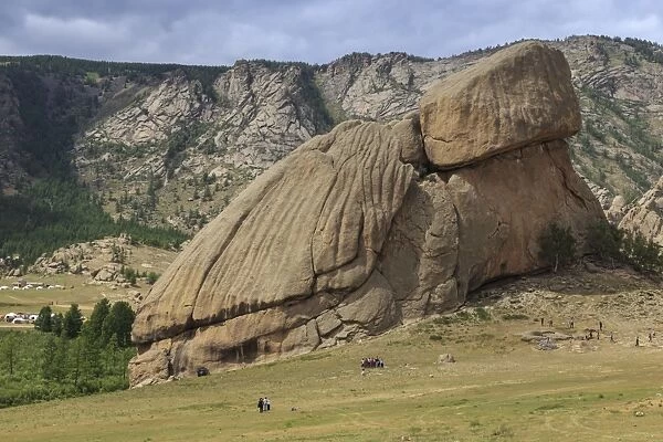 Turtle Rock, rock formation, with many visitors and distant tourist ger camps in summer