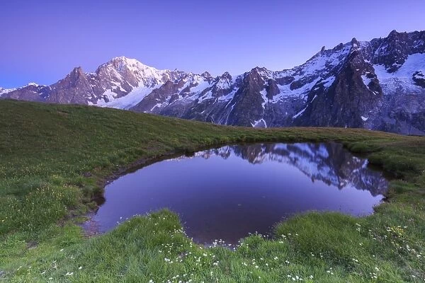 Twilight illuminates Mont Blanc, Mont de la Saxe, Ferret Valley, Courmayeur, Aosta Valley