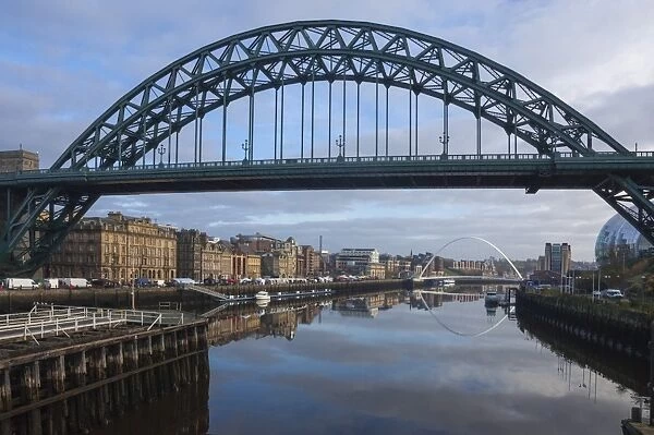 Tyne Bridge framing the Quayside Sunday Morning Market and the Millennium Bridge, River Tyne, Newcastle upon Tyne, Tyne and Wear, England, United Kingdom, Europe