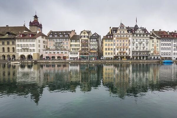 The typical buildings of the old medieval town are reflected in River Reuss, Lucerne