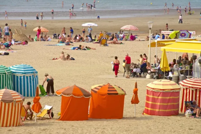 Framed Print : Typical color striped beach cabins, tourists, beach and sea, Trouville sur Mer, Normandy Framed Print : Typical color striped beach cabins, tourists, beach and sea, Trouville sur Mer, Normandy