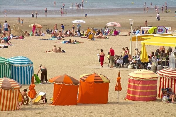 Typical color striped beach cabins, tourists, beach and sea, Trouville sur Mer, Normandy