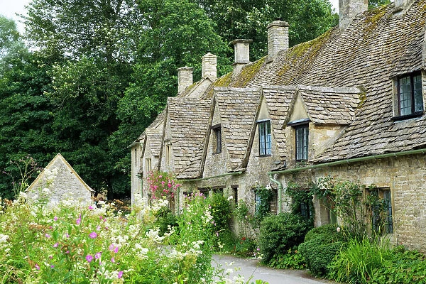 Typical Cotswold houses in the village of Bibury, The Cotswolds, Gloucestershire