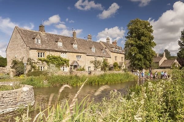 Typical Cotswolds stone houses in Lower Slaughter, Gloucestershire, England, United Kingdom
