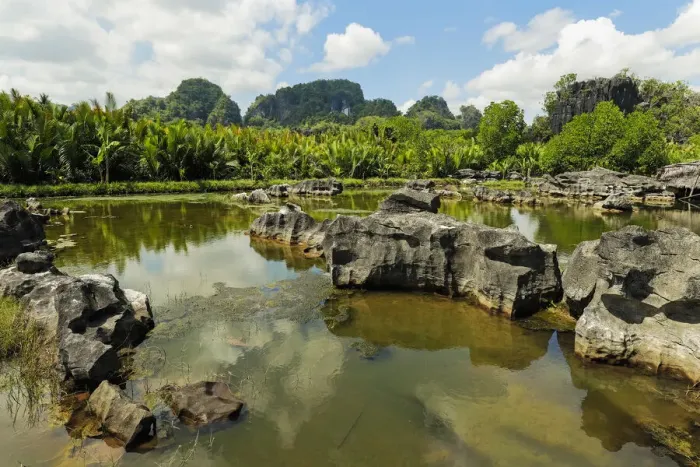 Framed Print : Typical eroded limestone outcrops and lake in karst region, Rammang-Rammang, Maros Framed Print : Typical eroded limestone outcrops and lake in karst region, Rammang-Rammang, Maros