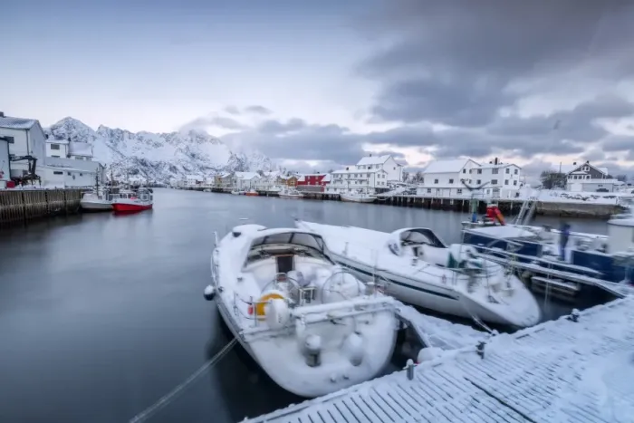 Framed Print : The typical fishing village of Henningsvaer surrounded by snow capped mountains and the cold sea Framed Print : The typical fishing village of Henningsvaer surrounded by snow capped mountains and the cold sea