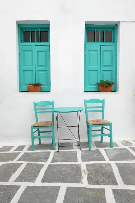 Framed Print : Typical Greek cafe table and chairs with shuttered windows, Pano Chora, Serifos, Cyclades