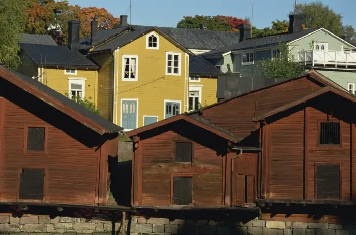 Framed Print : Typical heavy red of fishermens cottages and sheds lining the River Porvoo Framed Print : Typical heavy red of fishermens cottages and sheds lining the River Porvoo