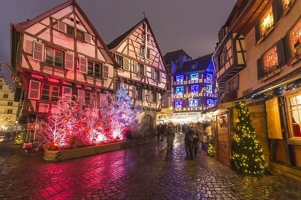 Typical houses enriched by Christmas ornaments and lights at dusk, Colmar, Haut-Rhin department
