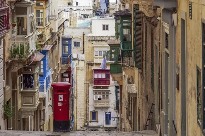 Framed Print : Typical street scene of alley with traditional homes, colorful balconies and red post box, Valletta, Malta, Europe Framed Print : Typical street scene of alley with traditional homes, colorful balconies and red post box, Valletta, Malta, Europe