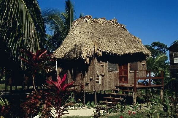 Typical thatched wooden hut on the island, Caye Caulker, Belize, Central America